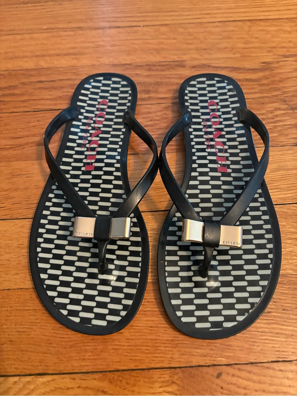 Coach Black Jelly Flip Flops with Gold Bow and Patterned Footbed sz 6